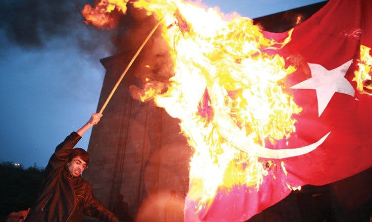 Photos of burning Turkish flags.