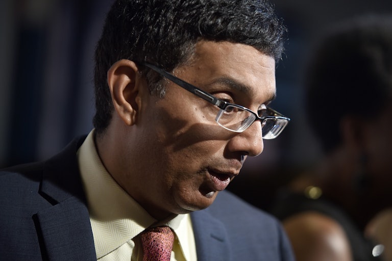 Dinesh D’Souza is seen in profile as he speaks