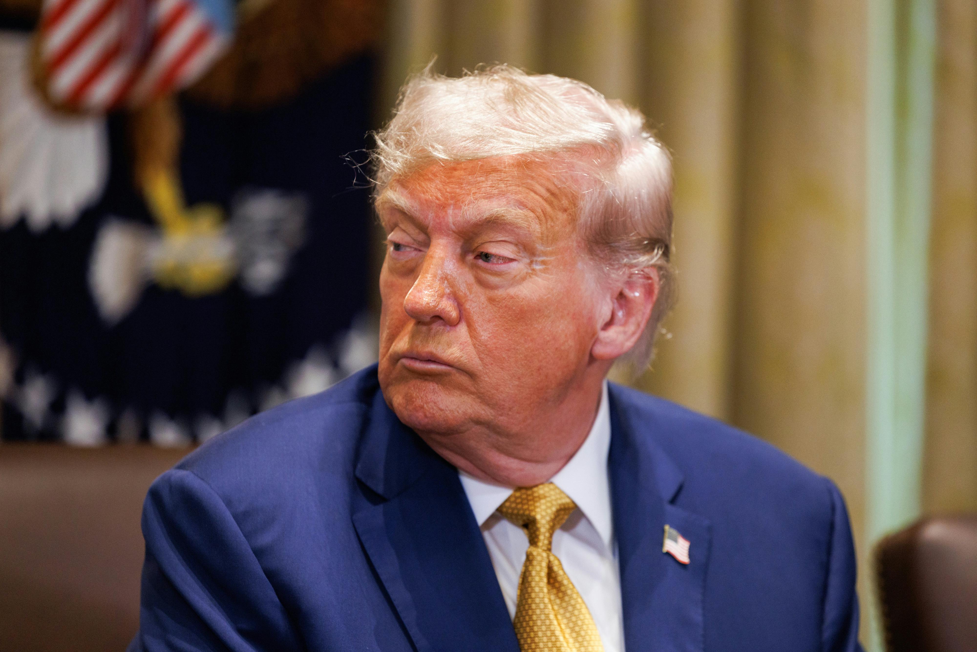 Trump turns his head looking perturbed 