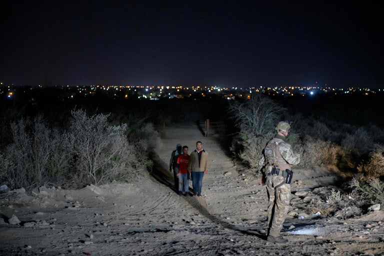 A group of undocumented immigrants move toward a border checkpoint in the Rio Grande Valley.
