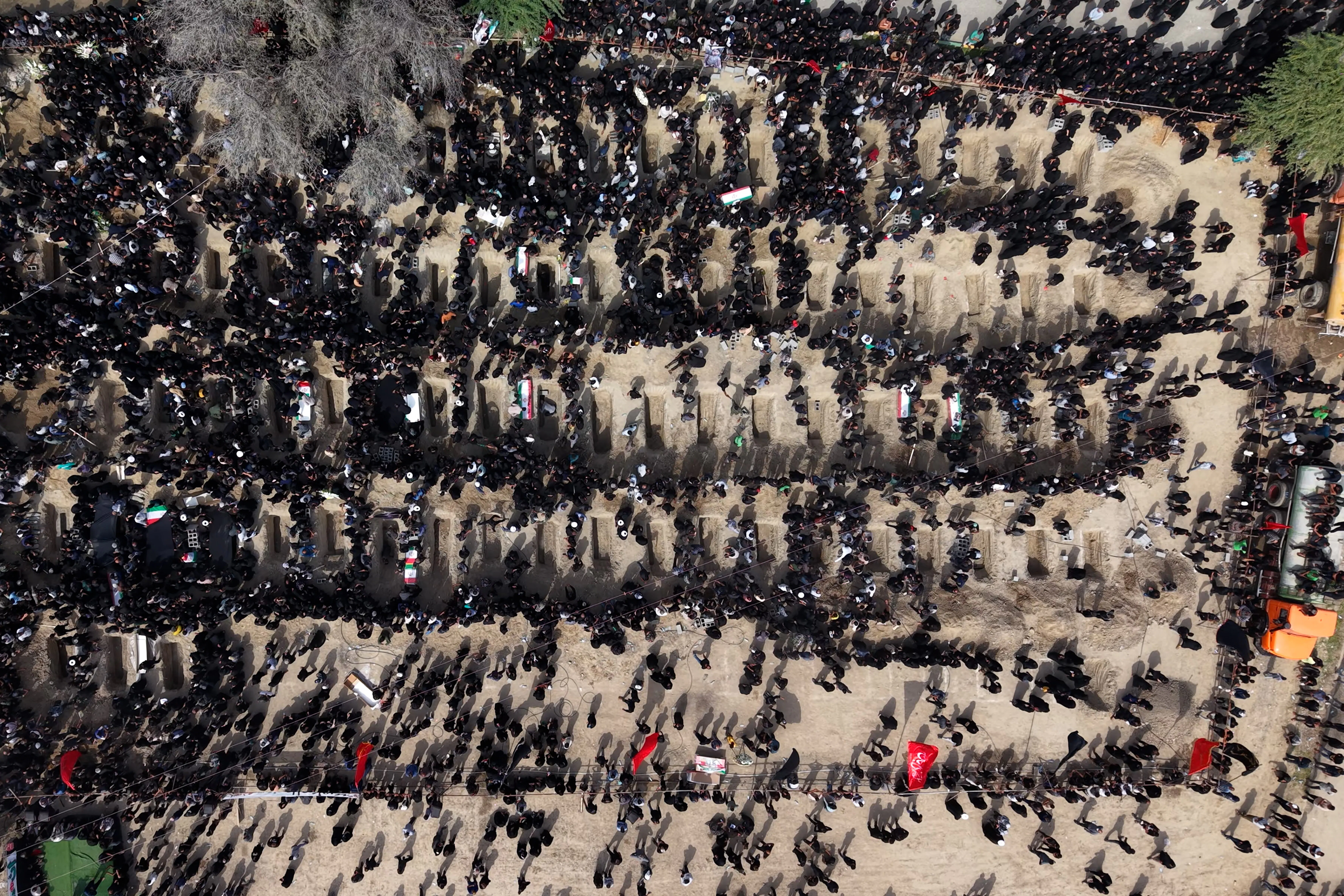 People attend a mass funeral for the children killed in a U.S.-Israeli strike on a girls’ school in southern Iran.