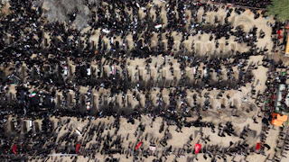 People attend a mass funeral for the children killed in a U.S.-Israeli strike on a girls’ school in southern Iran.