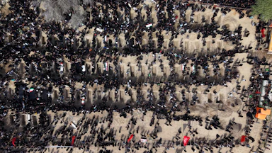 People attend a mass funeral for the children killed in a U.S.-Israeli strike on a girls’ school in southern Iran.