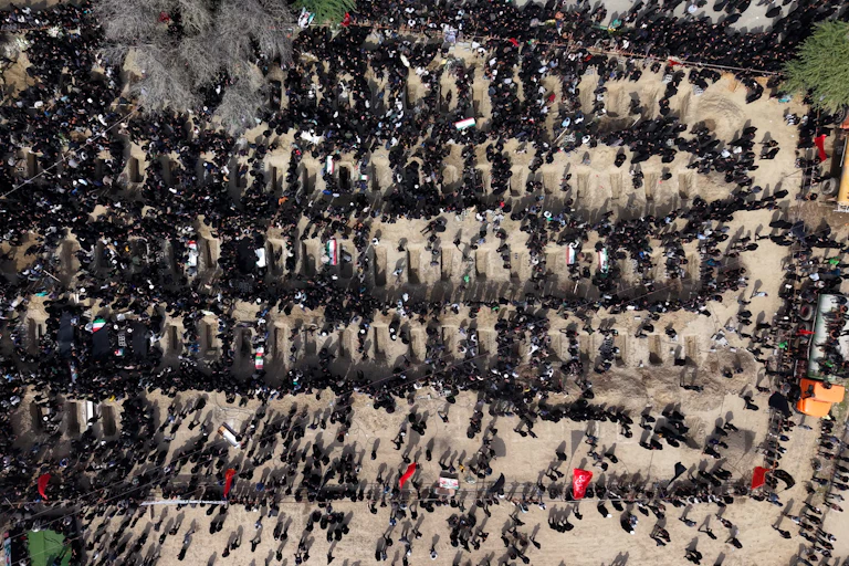 People attend a mass funeral for the children killed in a U.S.-Israeli strike on a girls’ school in southern Iran.