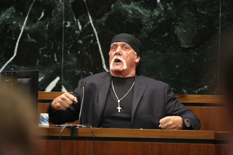 Hulk Hogan appears to be testifying and makes a weird face