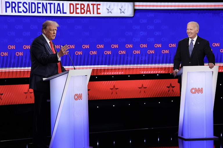 Donald Trump and Joe Biden stand at podiums