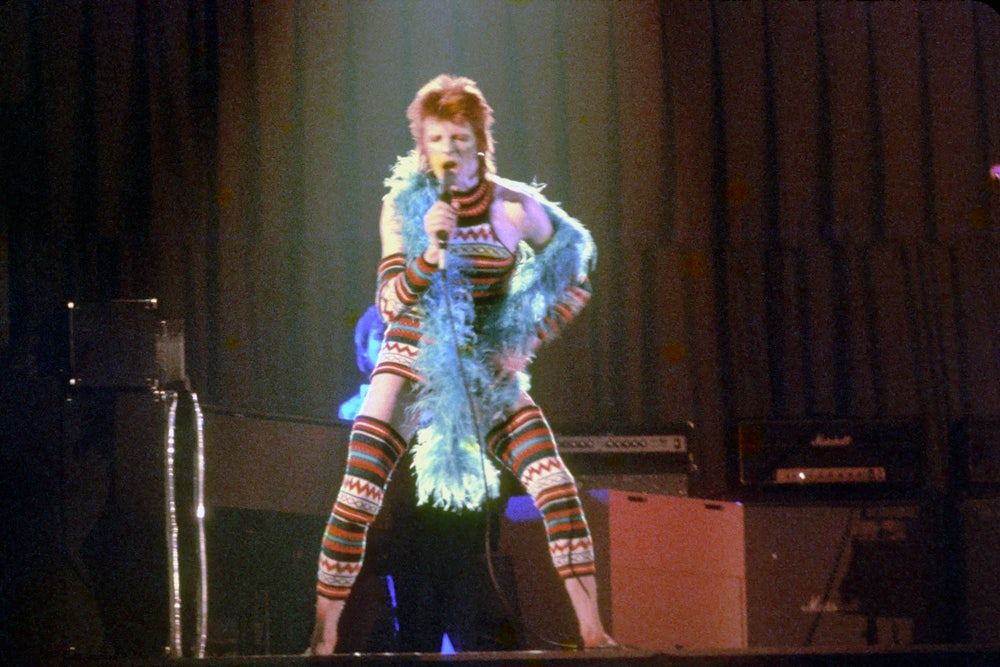 David Bowie performs onstage during his "Ziggy Stardust" era in 1973 in Los Angeles, California