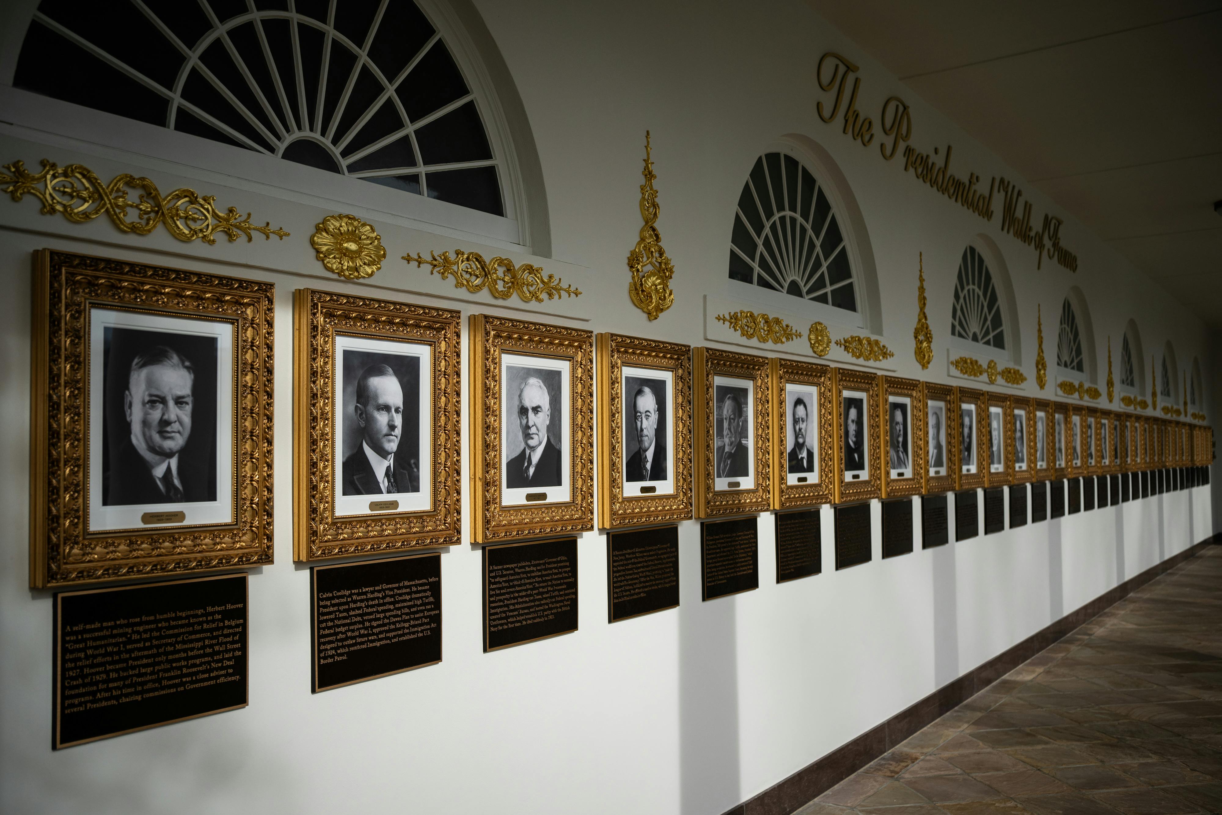 The White House's "Presidential Walk of Fame" with new added plaques under each portrait.