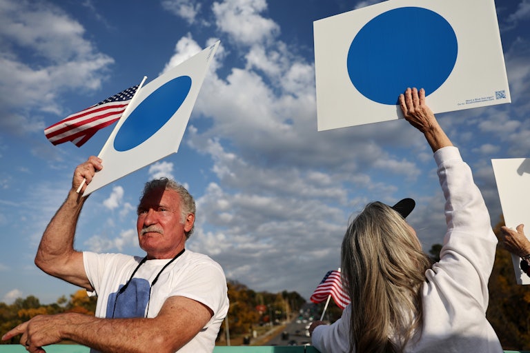 People hold up "Blue Dot" signs in Omaha, Nebraska