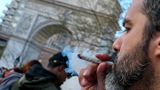 A marijuana enthusiast smokes a joint to celebrate 4/20 on World Weed Day in Washington Square Park.