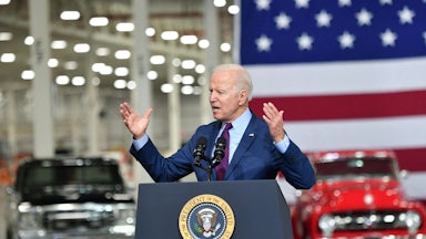Joe Biden speaks at a podium.