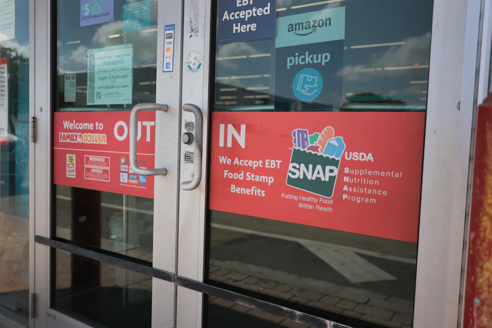 A sign indicates the store accepts SNAP benefits on April 21, 2026, in Miami, Florida.