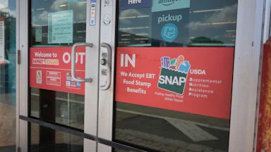 A sign indicates the store accepts SNAP benefits on April 21, 2026, in Miami, Florida.