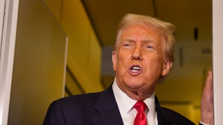 Donald Trump speaks to reporters on Air Force One