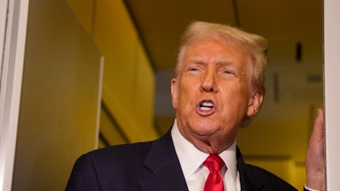 Donald Trump speaks to reporters on Air Force One