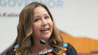 Representative Adelita Grijalva speaks at a podium.
