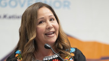 Representative Adelita Grijalva speaks at a podium.