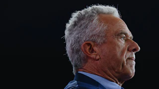 Robert F. Kennedy Jr. stands in profile
