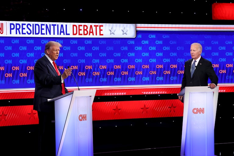 Donald Trump and Joe Biden stand at podiums
