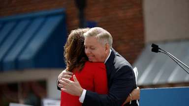 Senator Lindsey Graham hugs his sister Darline Graham Nordone during a campaign stop in 2015.
