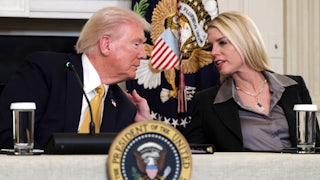 Attorney General Pam Bondi leans over to speak with Donald Trump, placing a hand on his shoulder.