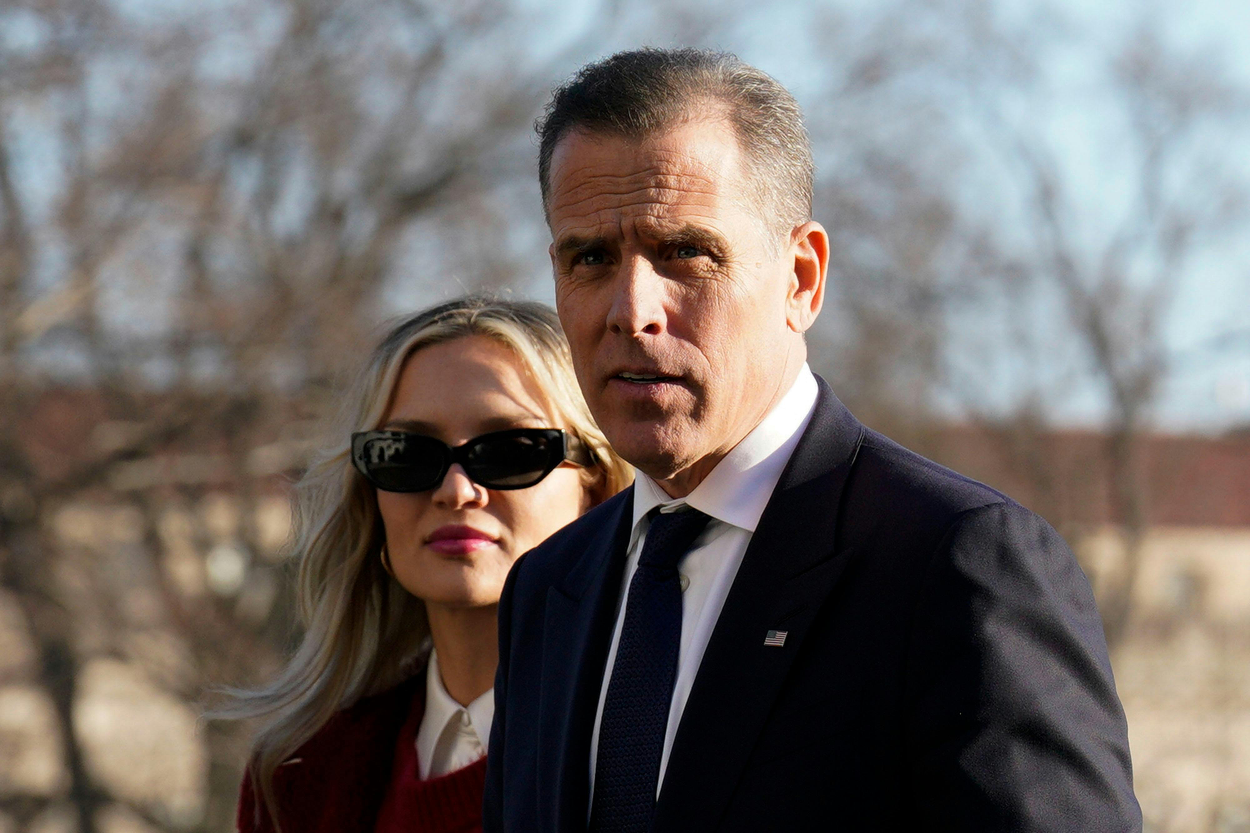 Hunter Biden walks with his wife