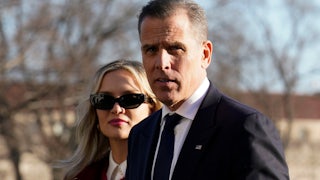 Hunter Biden walks with his wife