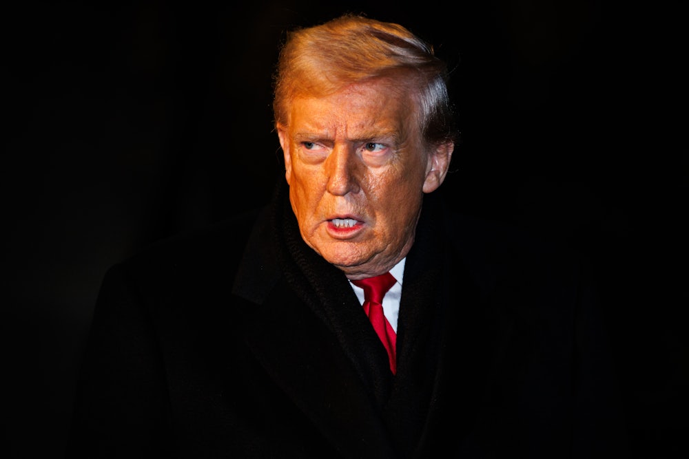 Donald Trump looks sideways with angry expression