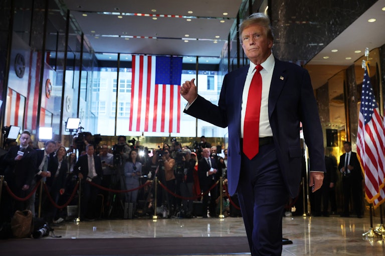 Donald Trump gestures as he walks