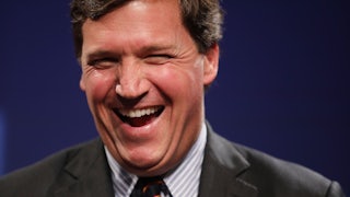 Fox News host Tucker Carlson laughing during happier times (for him).