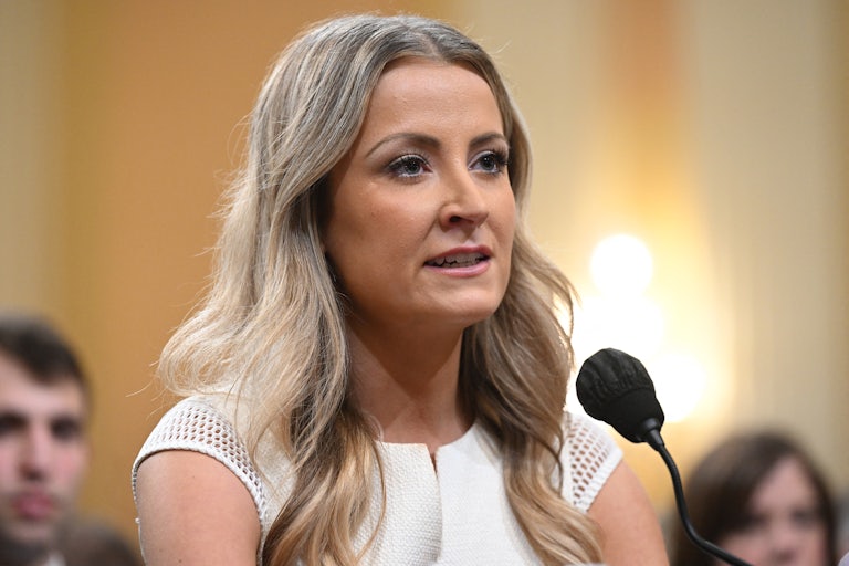 Sarah Matthews speaks into a microphone