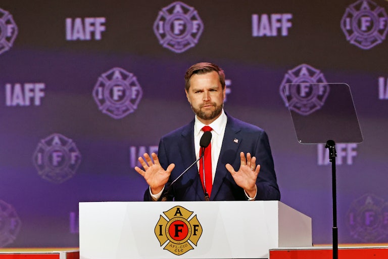 J.D. Vance gestures while speaking to the firefighters’ union