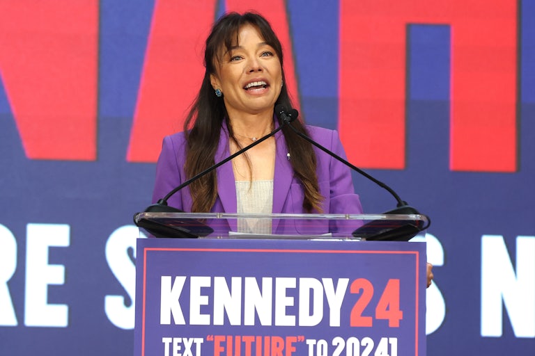 Nicole Shanahan speaks at a lectern that reads "Kennedy24."