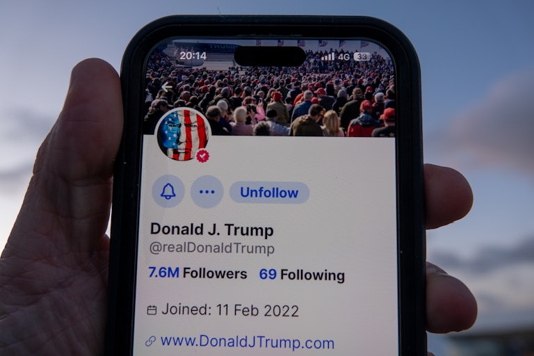 A phone shows Donald Trump’s Truth Social profile