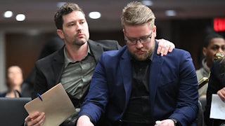 Brent Ganger puts his arm around his brother Luke Ganger after they testified in Congress about the death of their sister Renee Nicole Good