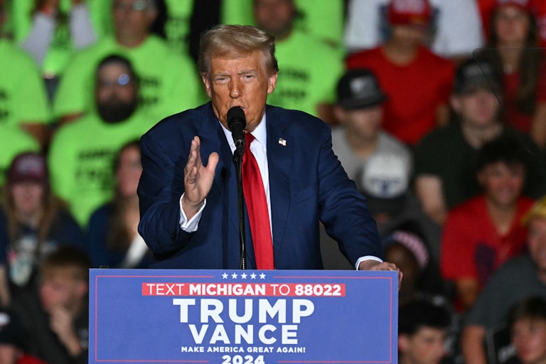 Donald Trump gestures while speaking at a campaign event