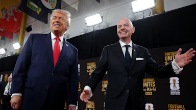 President Donald Trump and FIFA President Gianni Infantino smile for the cameras on the red carpet