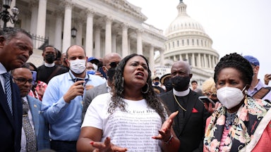 Cori Bush speaks before a large crowd on the steps of the Capitol.