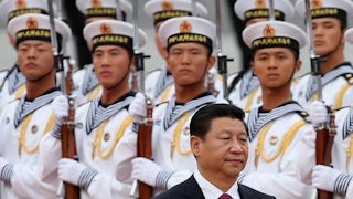 Chinese navy soldiers watch President Xi Jinping