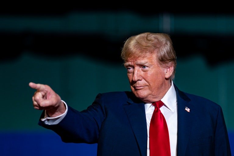 Donald Trump points off camera