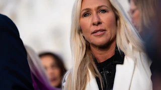 Marjorie Taylor Greene stares