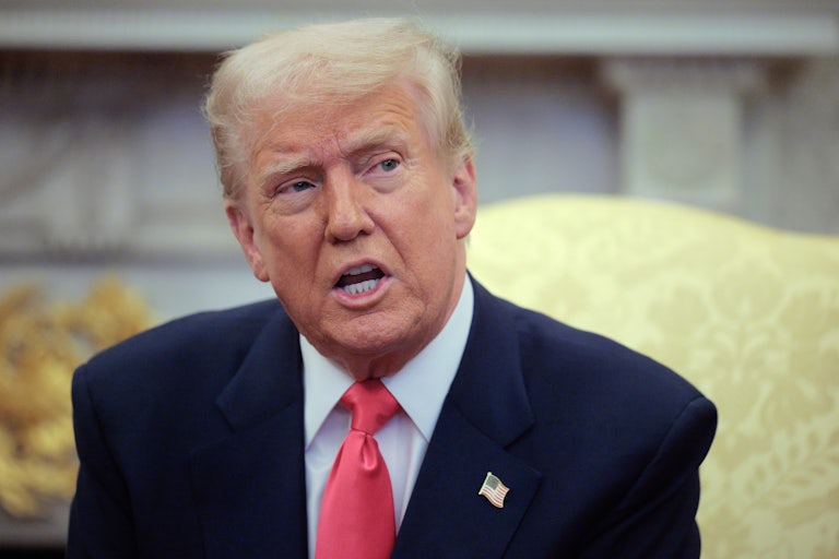 Donald Trump speaks while seated in the White House’s Oval Office