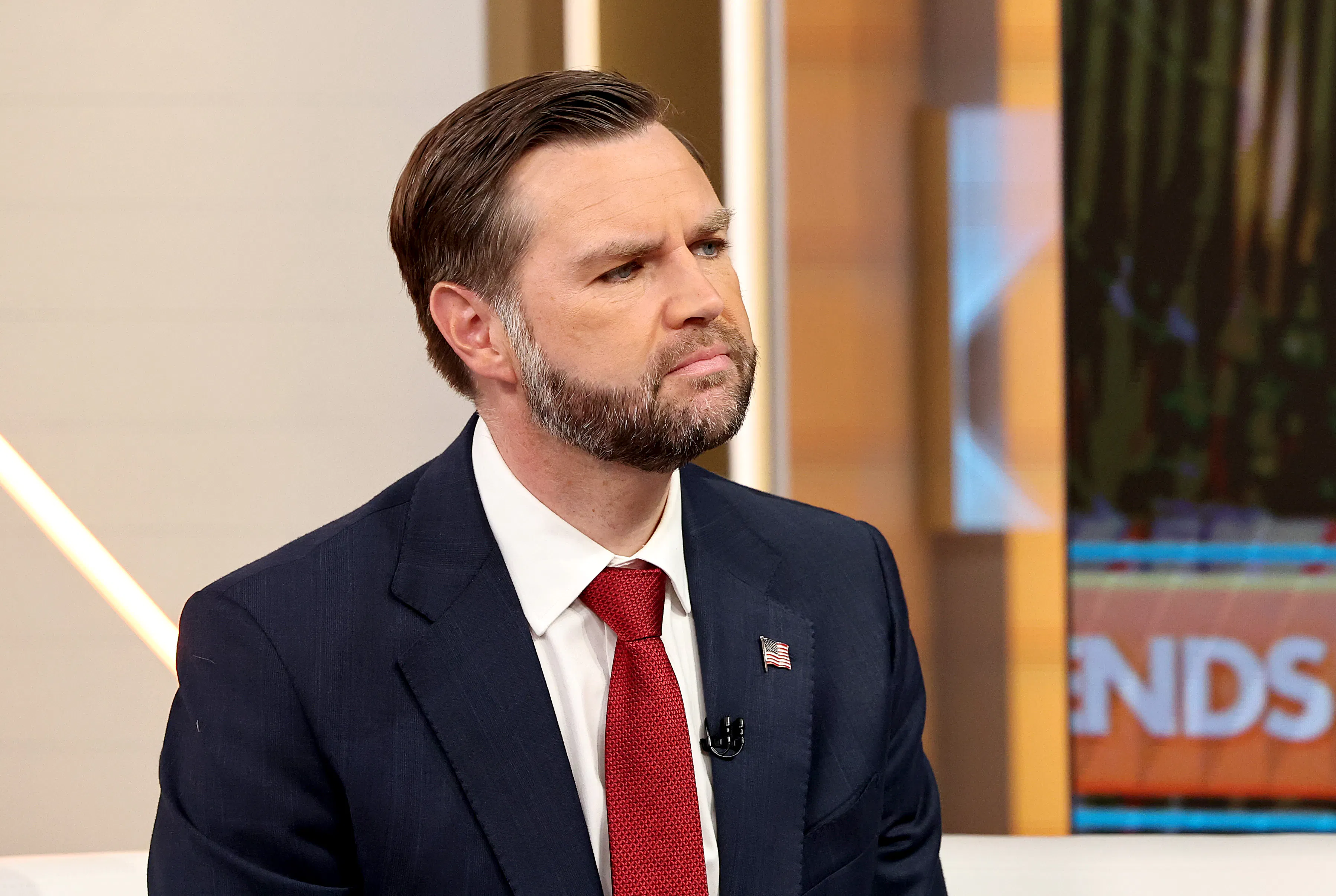 Vice President JD Vance raises his chin while sitting on the set of Fox & Friends