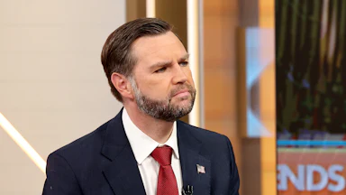 Vice President JD Vance raises his chin while sitting on the set of Fox & Friends