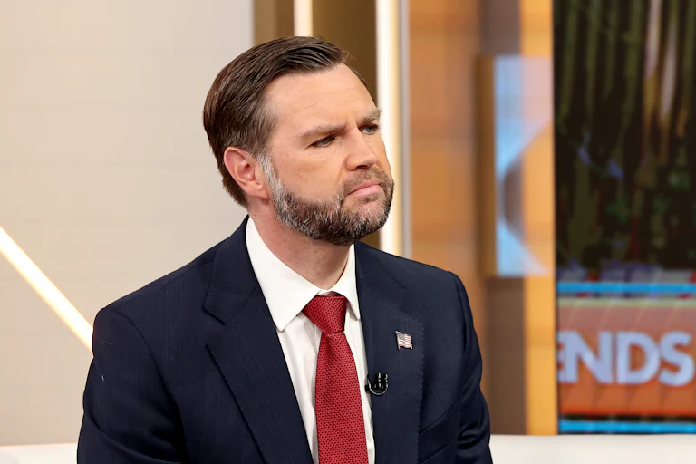 Vice President JD Vance raises his chin while sitting on the set of Fox & Friends