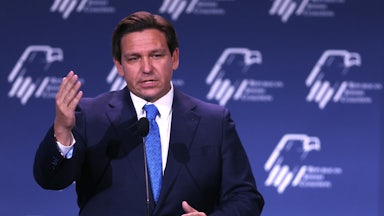 Ron DeSantis speaks at a podium