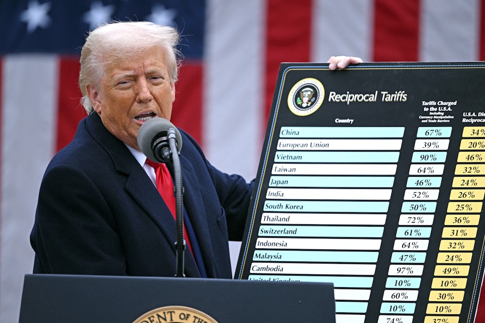 Donald Trump holds a chart as he delivers remarks on reciprocal tariffs during an event in the Rose Garden entitled “Make America Wealthy Again” at the White House.