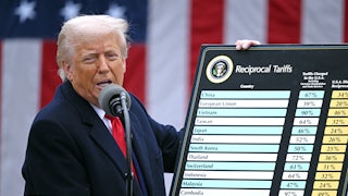 Donald Trump holds a chart as he delivers remarks on reciprocal tariffs during an event in the Rose Garden entitled “Make America Wealthy Again” at the White House.