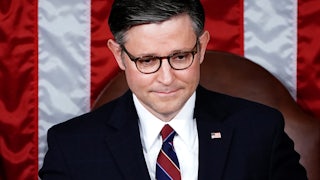 Mike Johnson looks slightly down