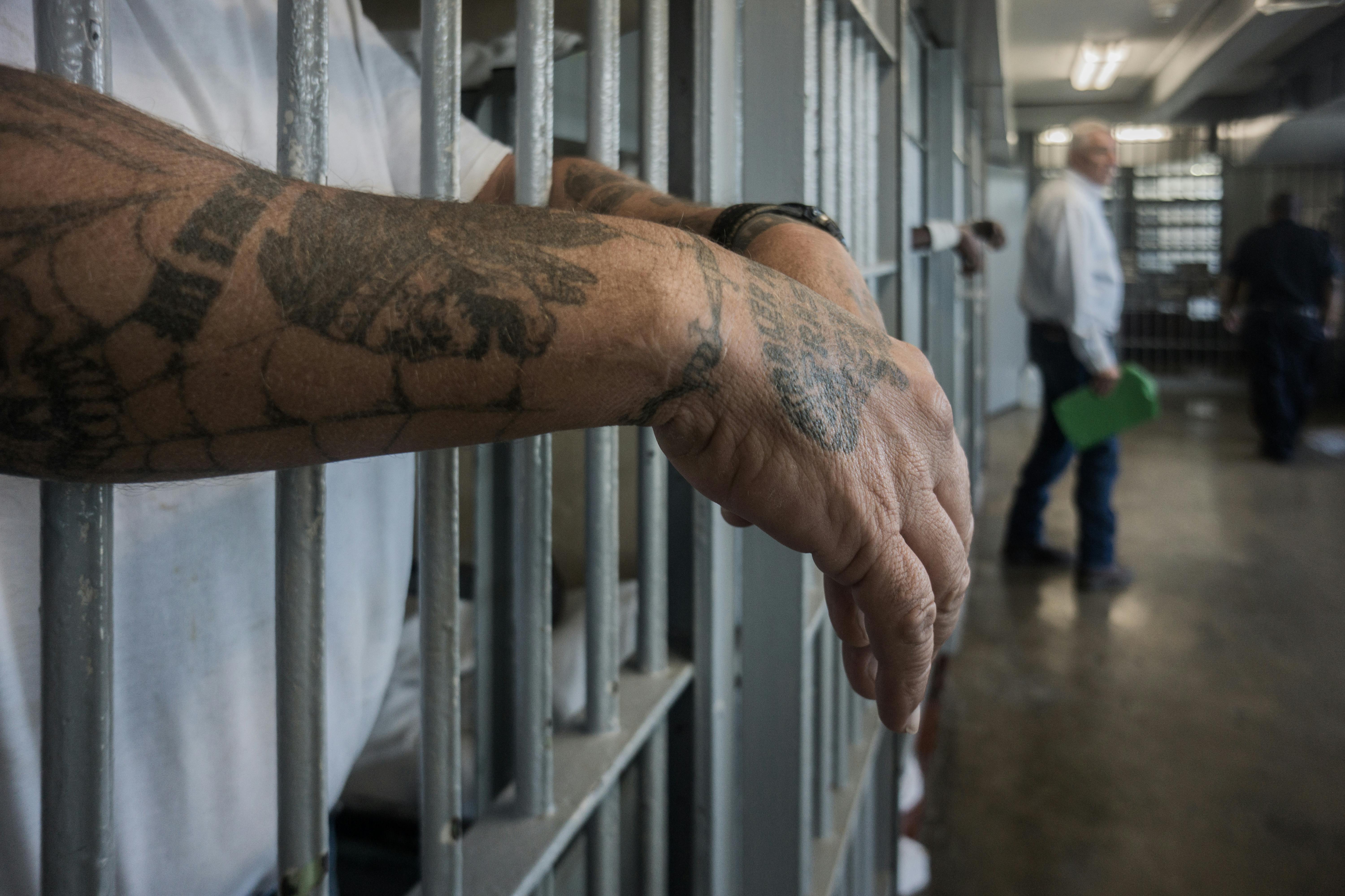 A prisoner's hands inside a punishment cell wing at Angola prison. 